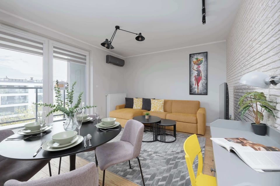 The bright, cosy living room interior is harmoniously combined with the dining area.