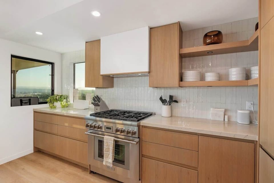Fully stocked kitchen with new modern appliances and a generous amount of counter space for cooking and entertaining.