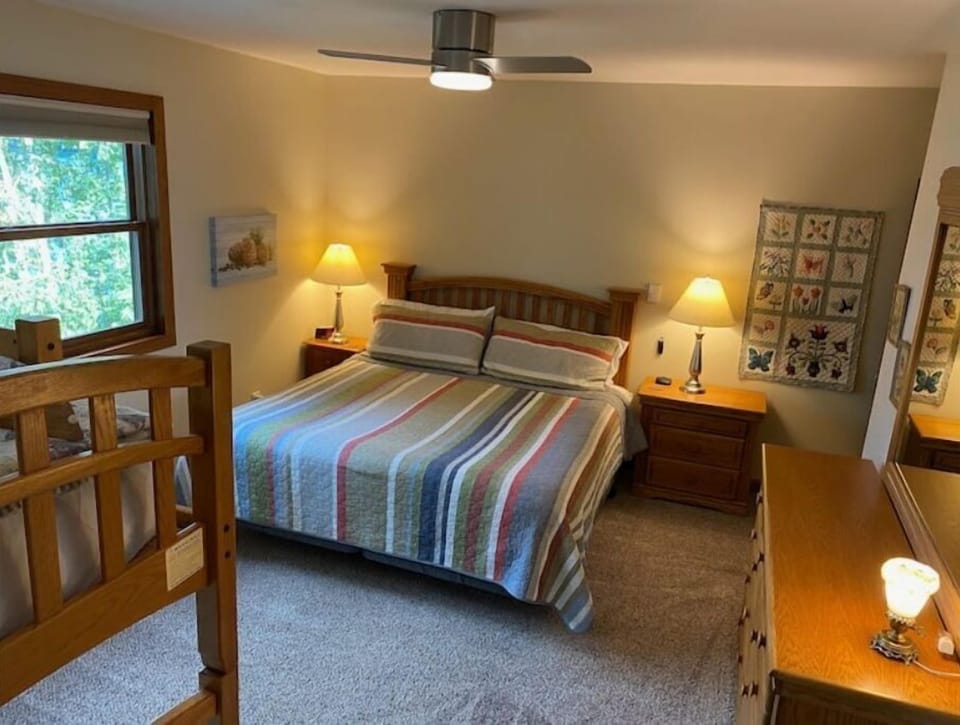 Bedroom 2, king, standard twin bunk. overlooks lake, ceiling fan.