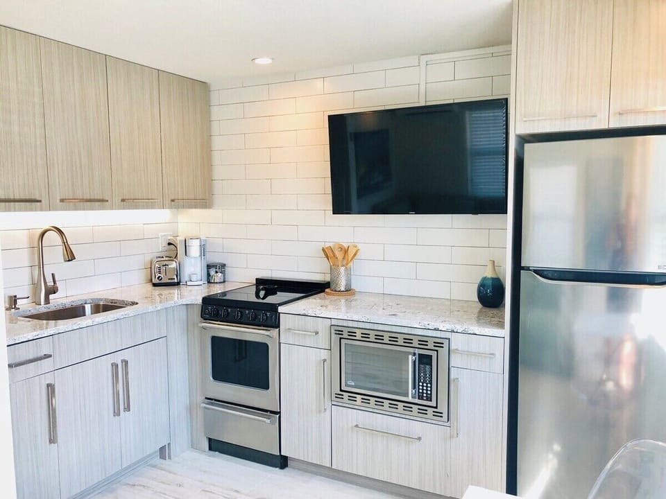 Fully equipped kitchen - not one, but two!!!  Each side of the duplex has private parking, a common patio, and individual kitchens, family rooms, bedrooms, bathrooms, etc.  Perfect for couples traveling together or family needing their own space. 