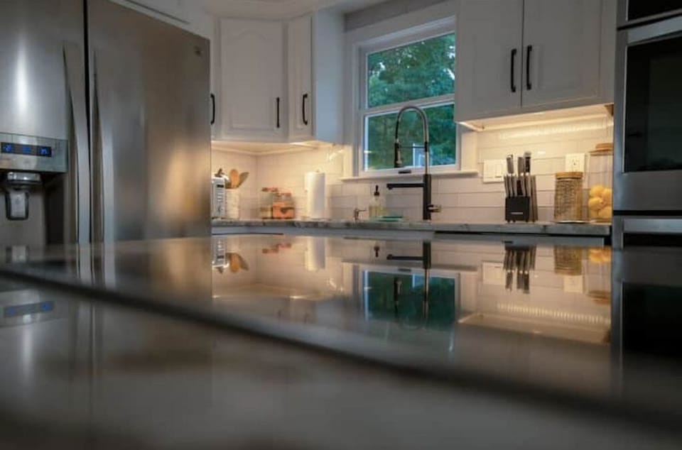 Stainless Steel Appliances In Fully Equipped Kitchen