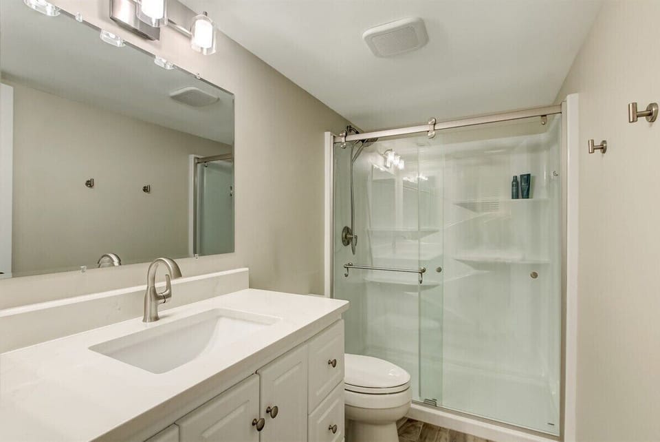 Upgraded Finishes in the Primary Bathroom with Walk In Shower (hair dryer included)