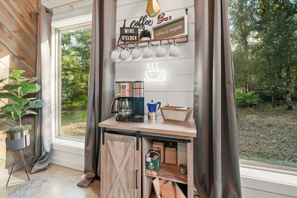 You’ll love the convenience of the charming coffee bar, so close to the living room that you can easily grab a cuppa as you’re lounging and watching TV. Both regular coffeemakers and Keurig are provided with Kcups, ground coffee, sugar, and creamer.