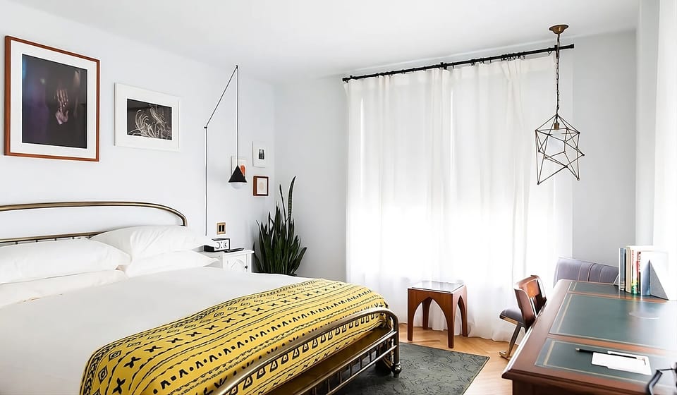 Lounge with morning light and art-filled walls for calm.