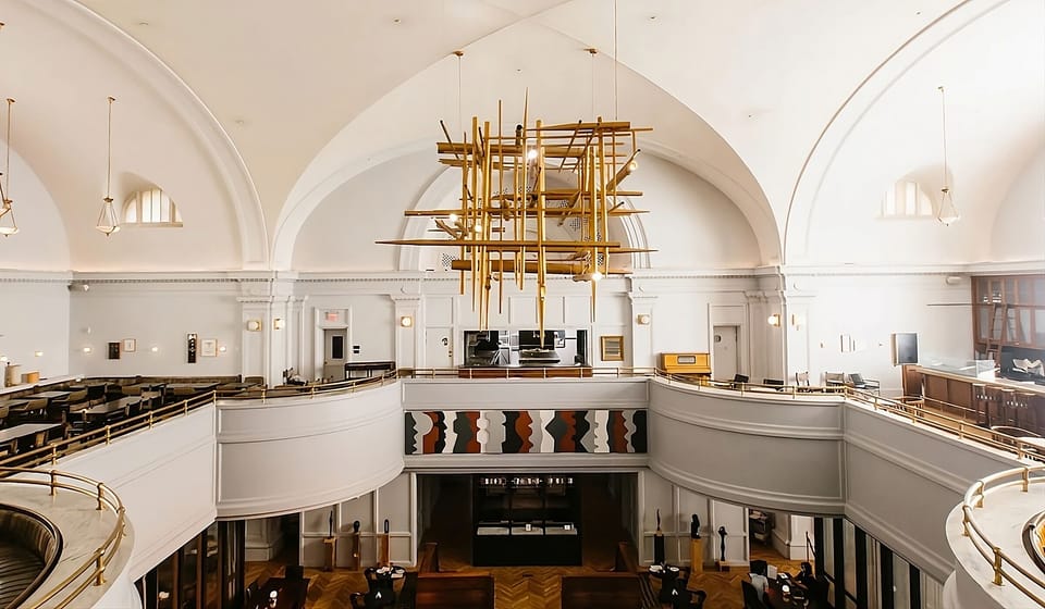 Soak in soaring arches and a statement chandelier overhead.