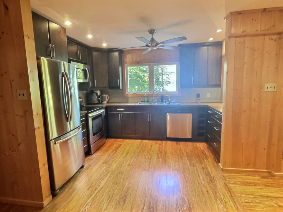 Full kitchen with dishwasher, fridge, stove, and microwave. All cooking utensils here!
