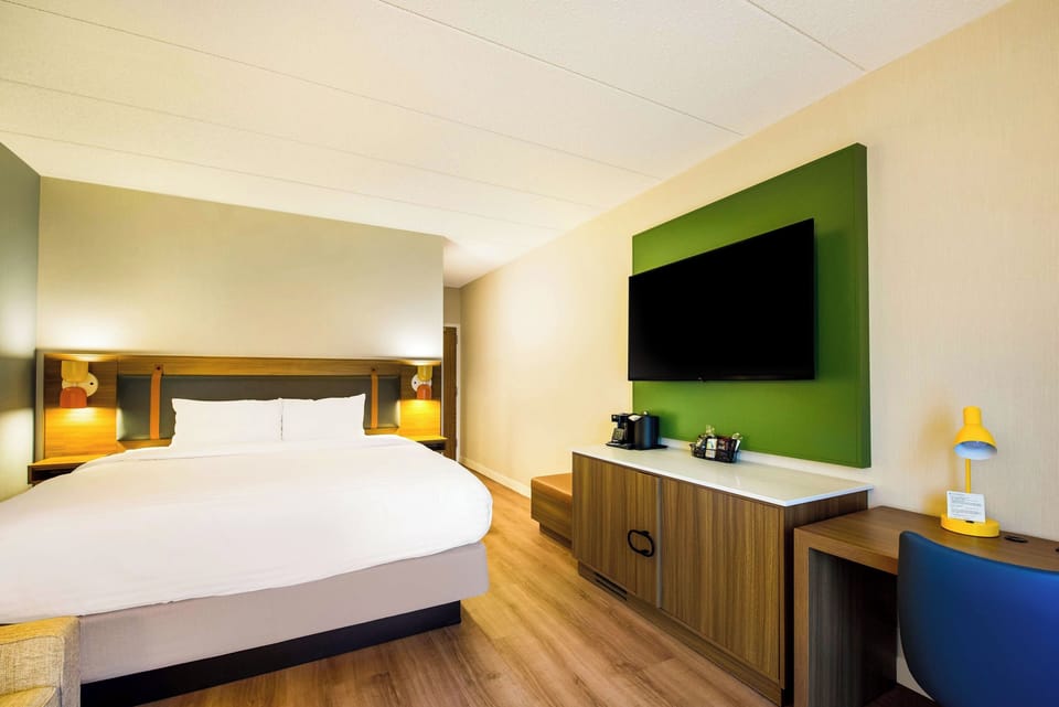 Unwind with big-screen entertainment and a tidy in-room refreshment station.
