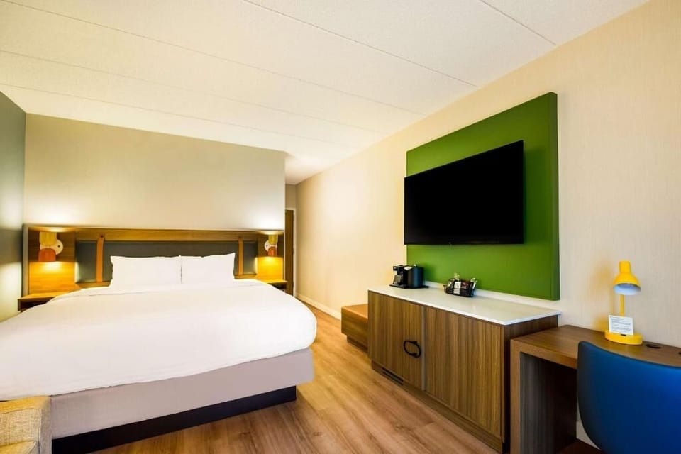 Kick back with a big-screen TV and in-room coffee station.