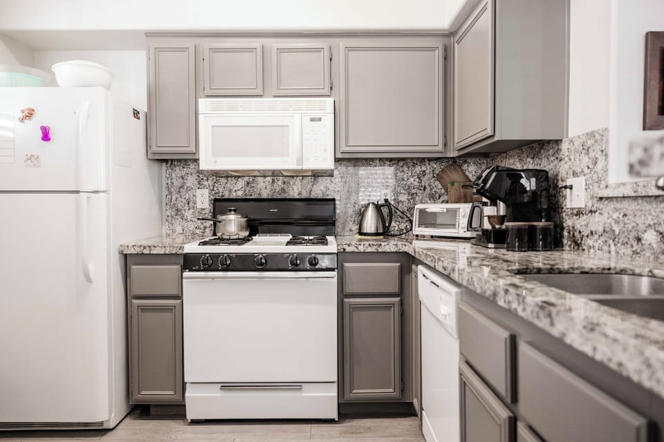 Fully-stocked kitchen. Coffee/tea bar, pots/pans, toaster oven, dishware, silverware, etc.