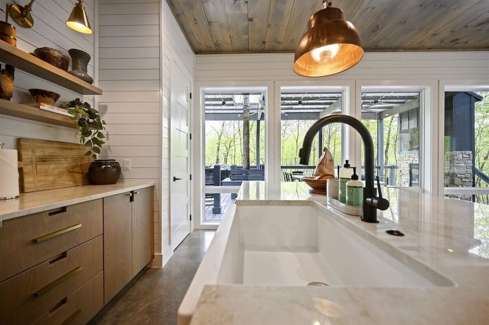 Kitchen: Stylish cabinetry and views of nature make cooking a delight in this inviting space!
