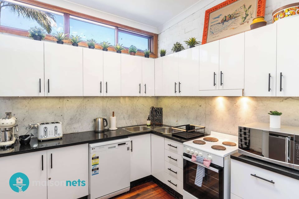 Full kitchen  with microwave and dishwashe