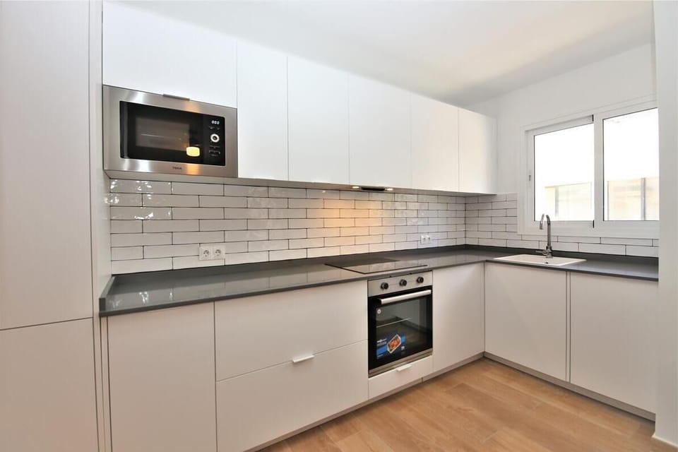 Another view of the bright open kitchen from another angle