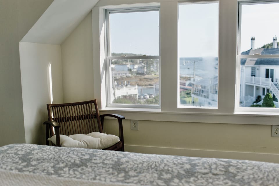 Soak in peaceful harbor scenes from your private perch in Room 7, where coastal charm and comfort meet sweeping Boothbay Harbor views.