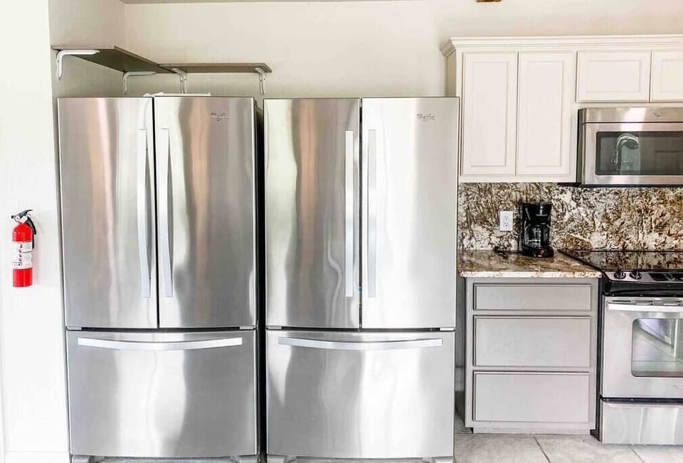 Ice maker in one of the two refrigerators 