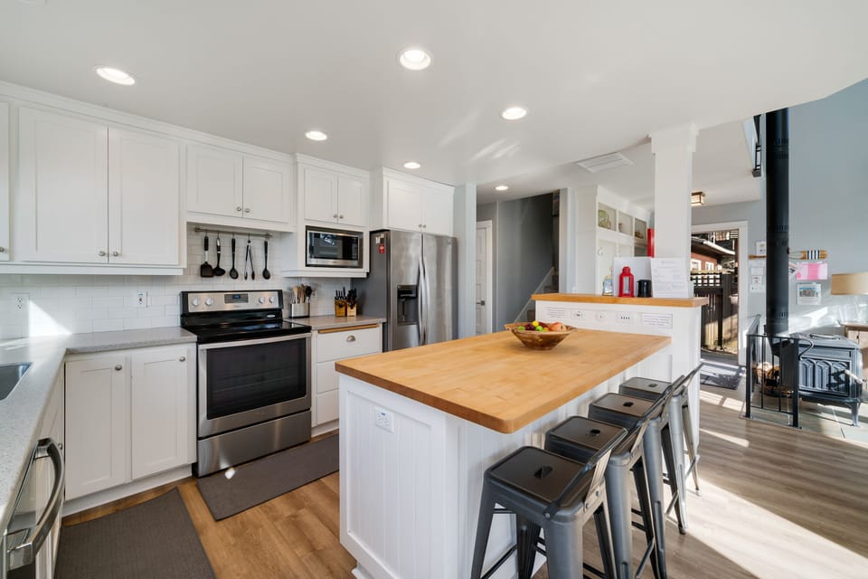 Fully equipped kitchen with Ocean views, breakfast bar and open to living and dining room.