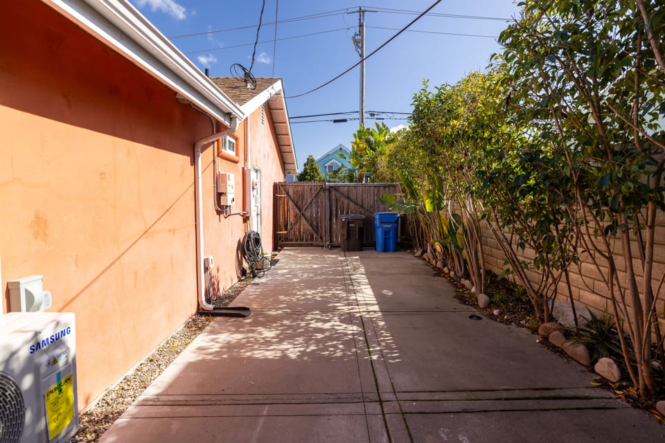 Extra parking for larger vehicles or more cars. Driveway gate opens in.