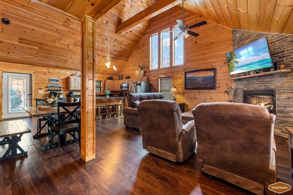 Relax by the fire in this spacious, inviting living room.