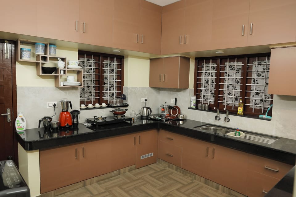 Kitchen 1.
ground floor.
Washing machine, mixy, cooking gas stove, Kettle etc.