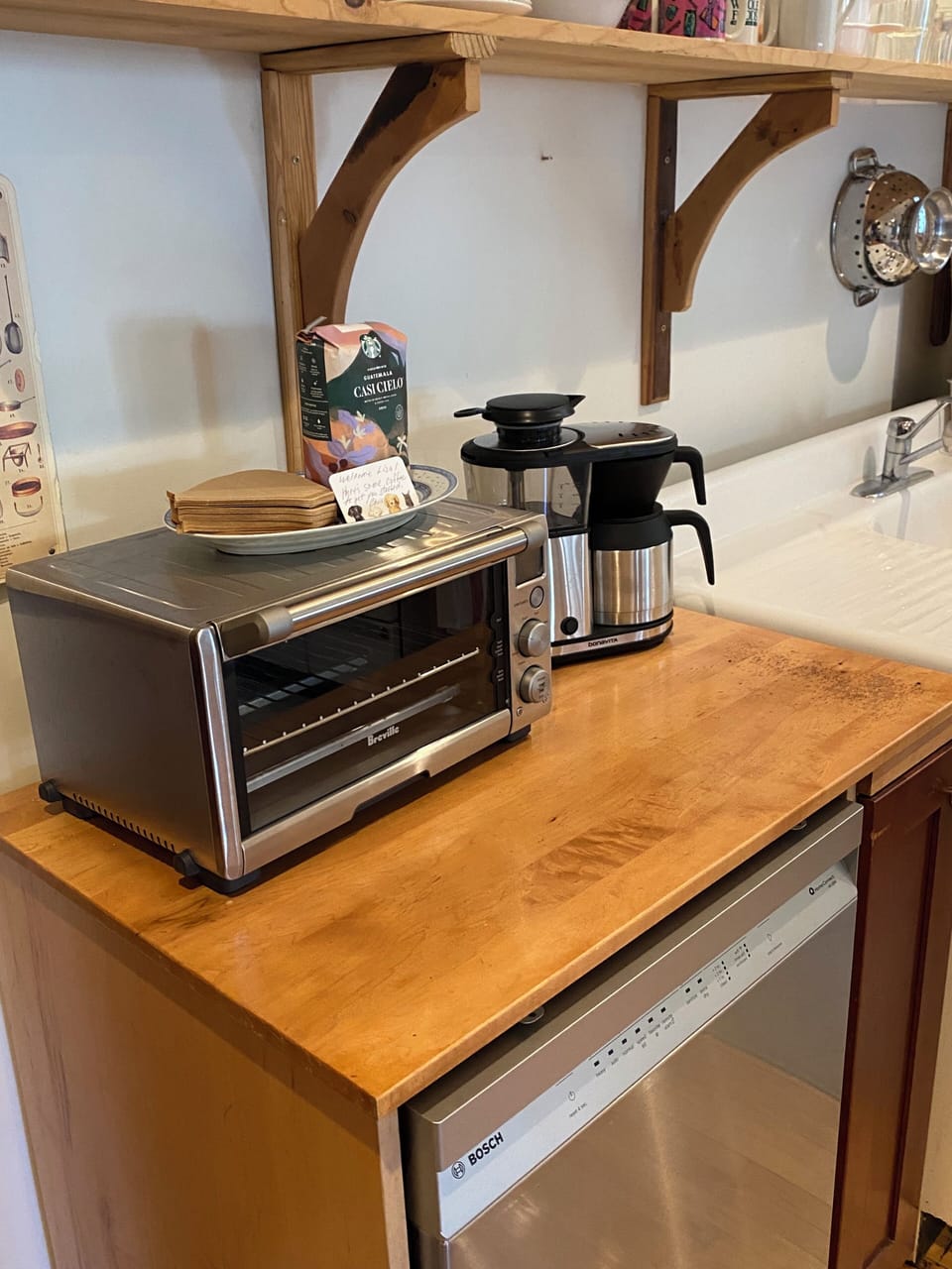 Kitchen coffee station with toaster oven.