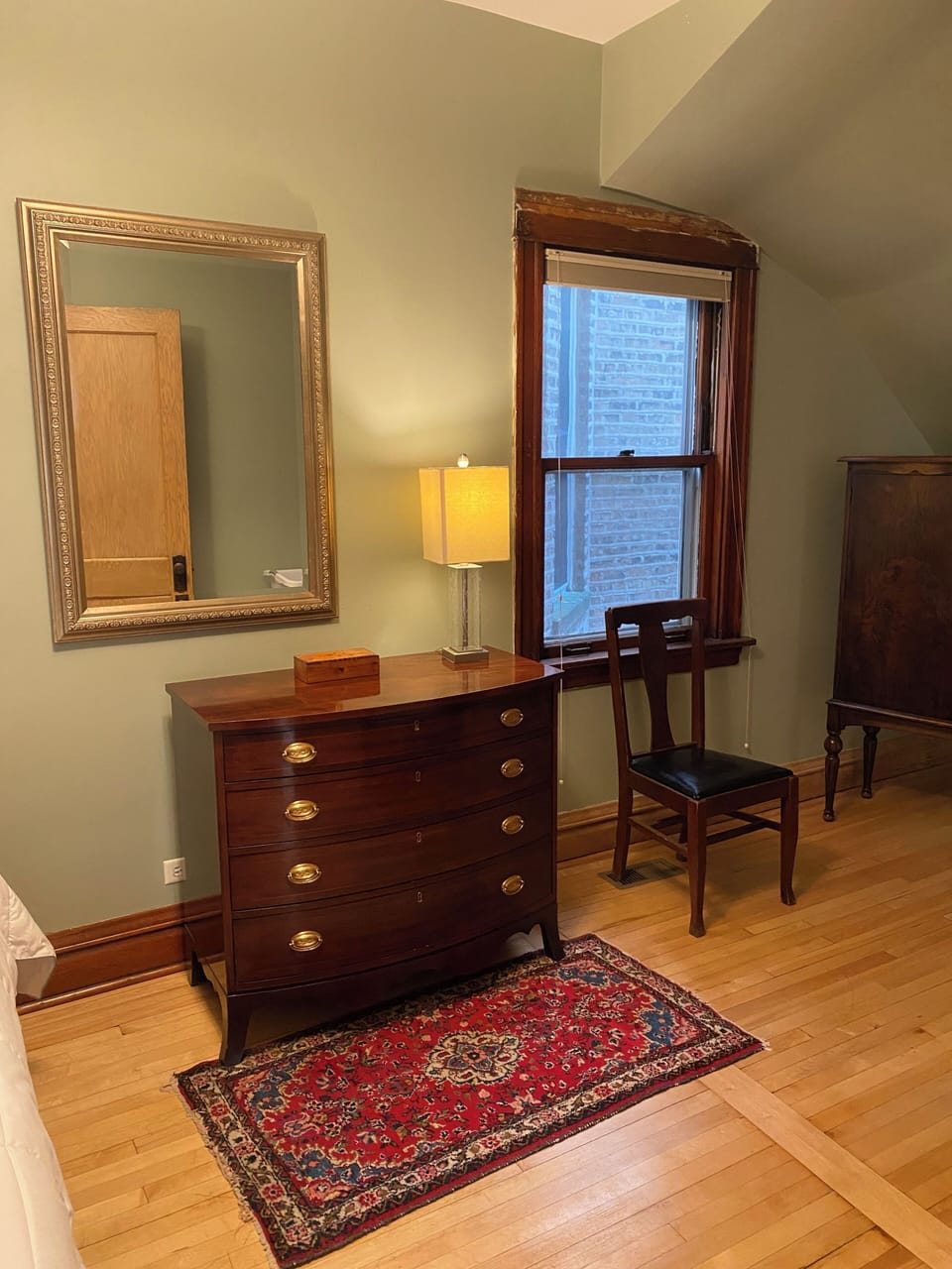 Bedroom 1 dresser and sitting area.
