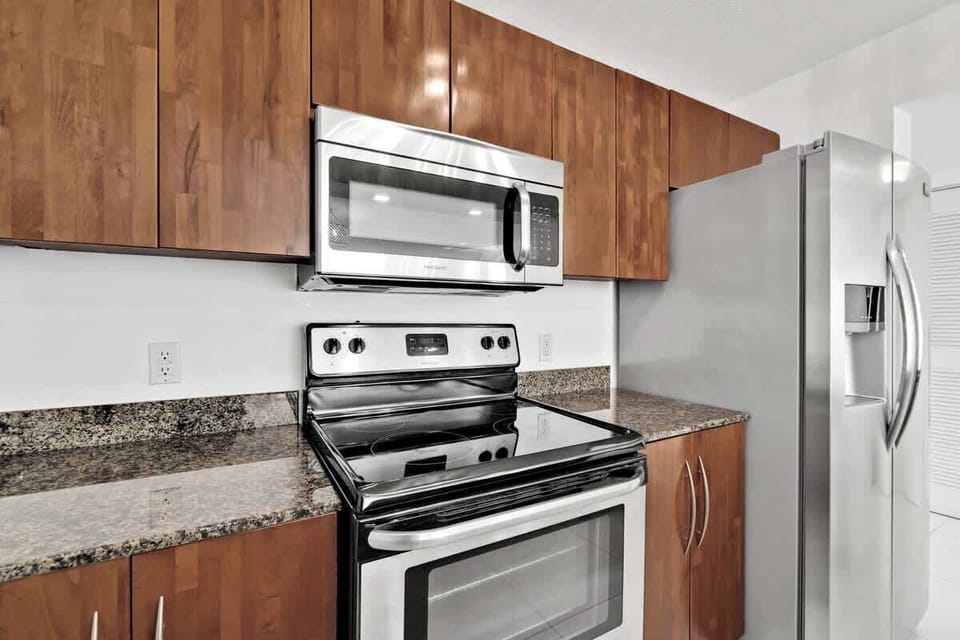Fully stocked kitchen with complete set of cookware.