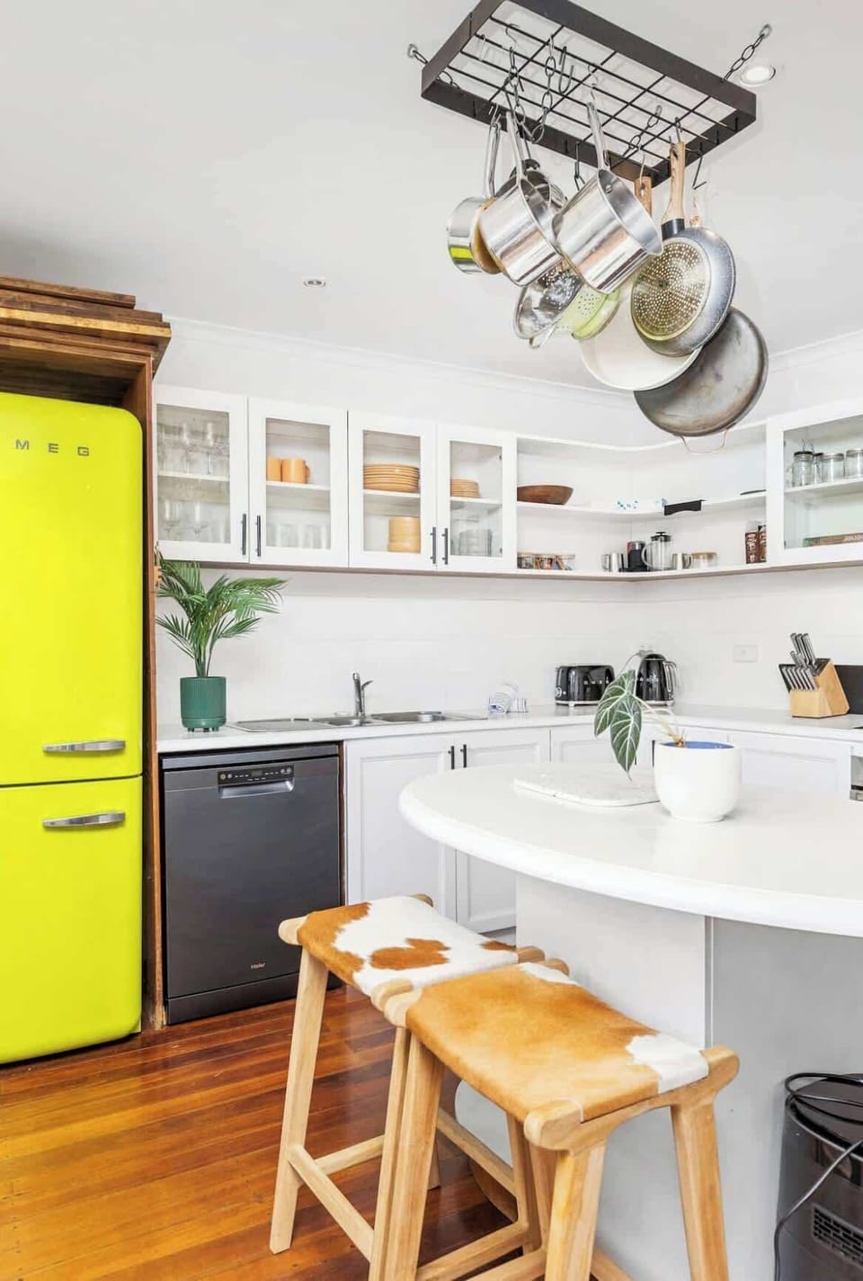 Step into a fully equipped kitchen, featuring a stylish fridge, oven, and microwave for all your cooking needs. You'll find a complete set of cutlery and dinnerware, ensuring a seamless and enjoyable dining experience during your stay.
