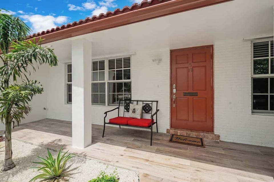 Welcome to the inviting entrance where a cozy 2-seater chair awaits, offering a comfortable and stylish space to relax and unwind.