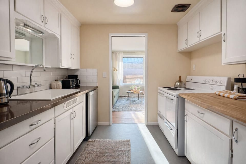 Clean, modern finishes blend with vintage style and quality appliances to make this kitchen both functional and stylish