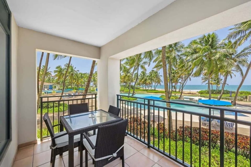 Living area balcony with a 4 person dining table