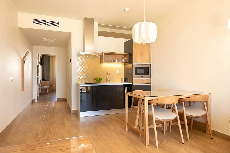 Cook and connect in a modern kitchen with warm dining.