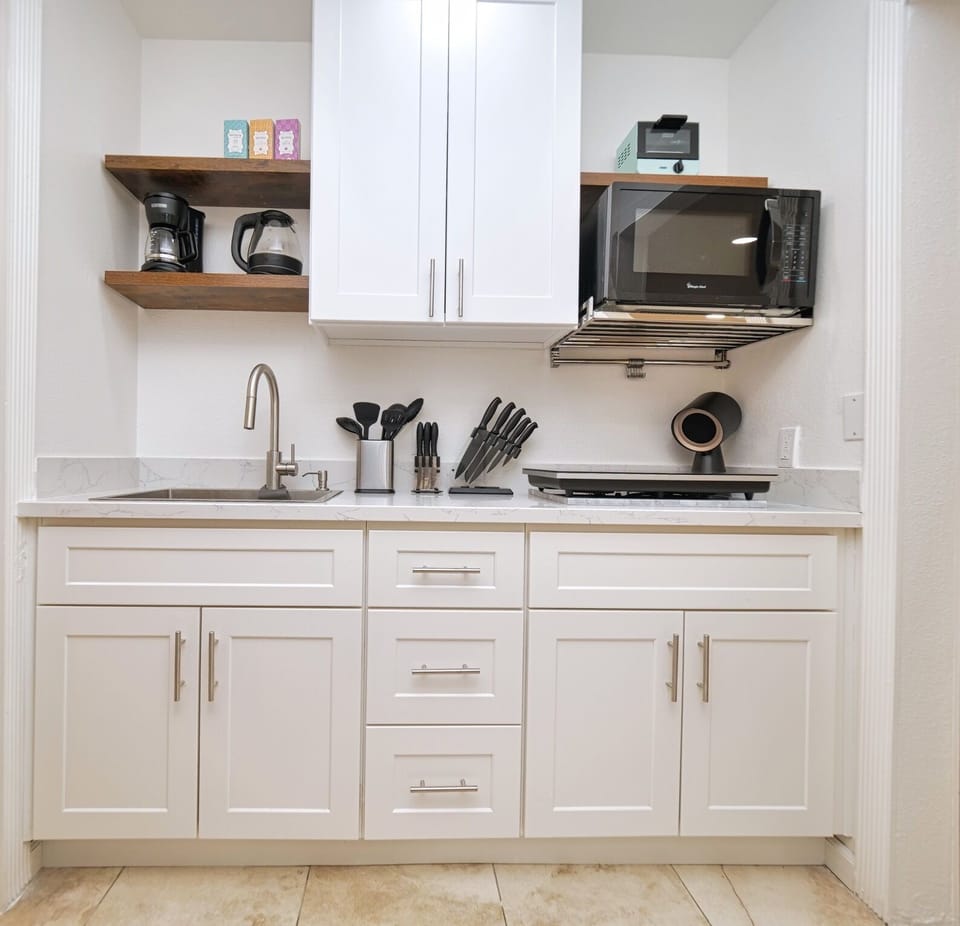 Fully stocked kitchenette with every essential appliances