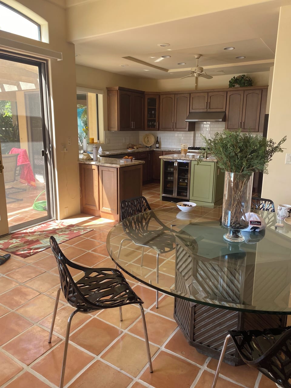 Fully stocked kitchen overlooking pool deck 