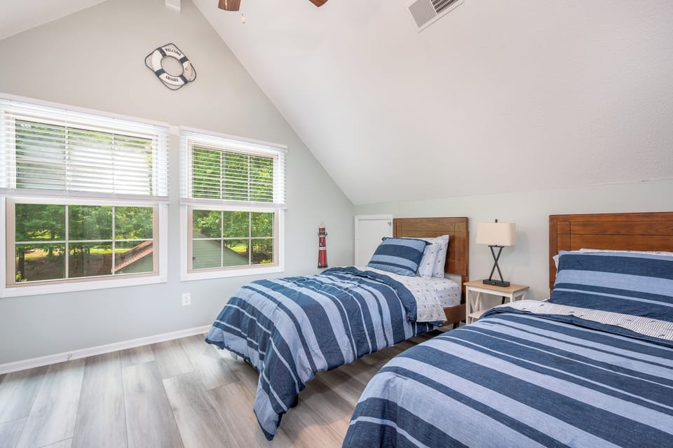 Loft bedroom with two twin beds - great for kids or extra guests
