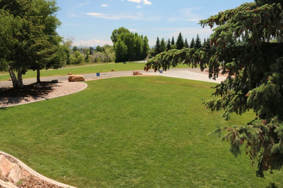 Lawn for yard games and has fire pit