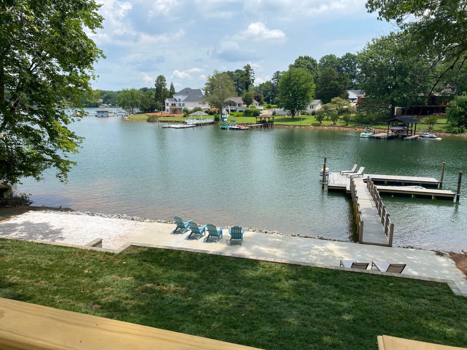 Lakeside patio,beach and dock from deck