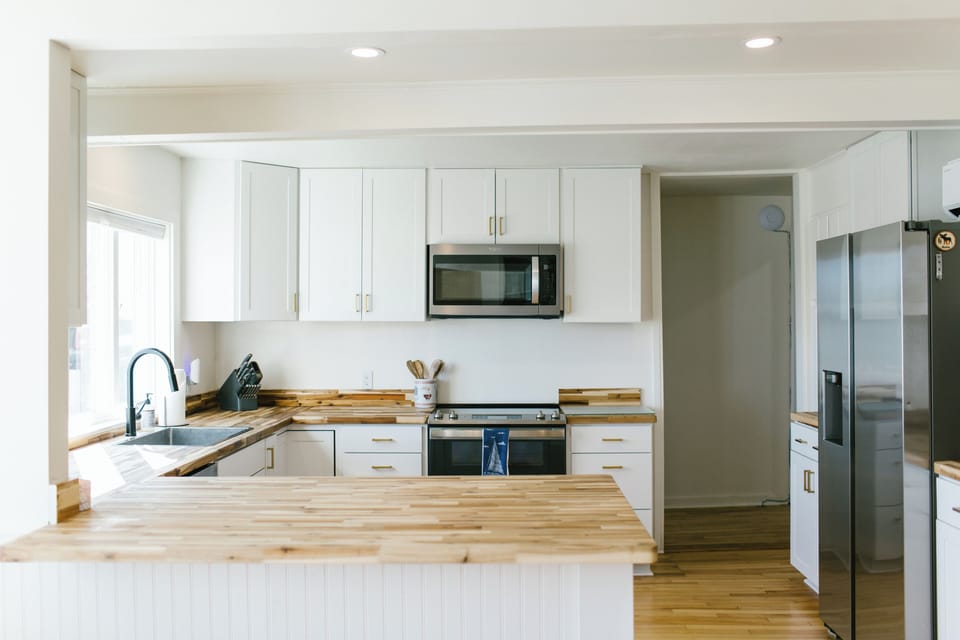 Enjoy access to a bright, fully equipped guest kitchen featuring stainless steel appliances, microwave, full fridge, stove, and butcher-block countertops—perfect for light cooking or storing local treats during your stay in Boothbay Harbor.