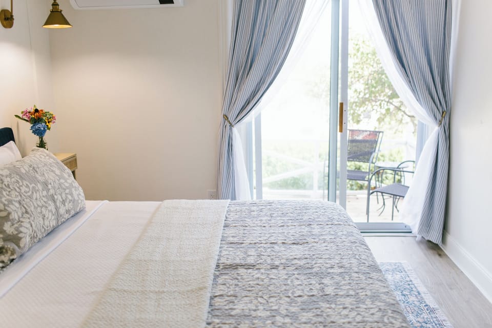 Enjoy direct patio access from Room 2's cozy king bed. Wake to garden views, fresh coastal air, and classic Maine charm in this serene Boothbay Harbor retreat.
