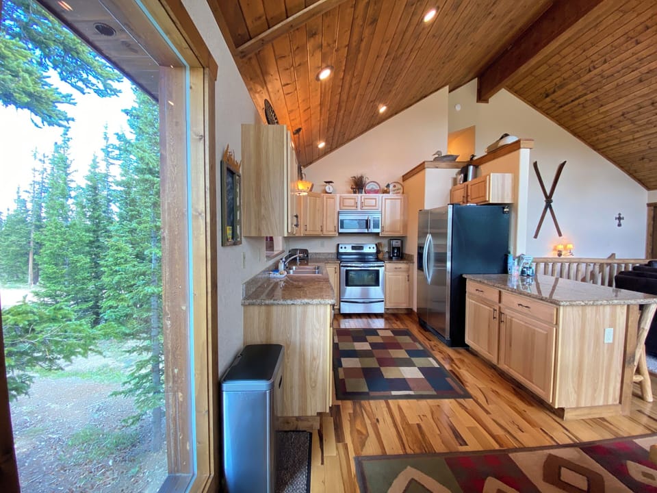The well appointed Kitchen features stainless steel appliances...