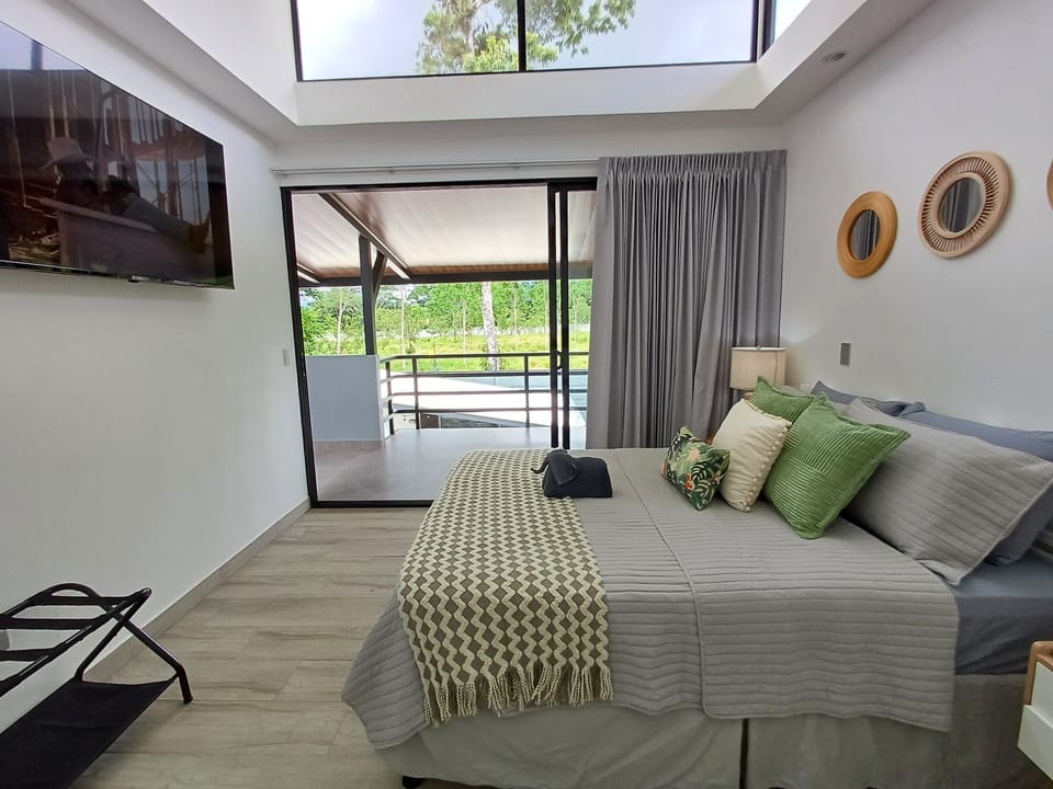 Bedroom 2: Queen bed, A/C unit, smart TV and private bathroom