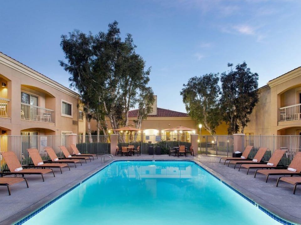 Unwind poolside at dusk with peaceful, resort-style vibes.
