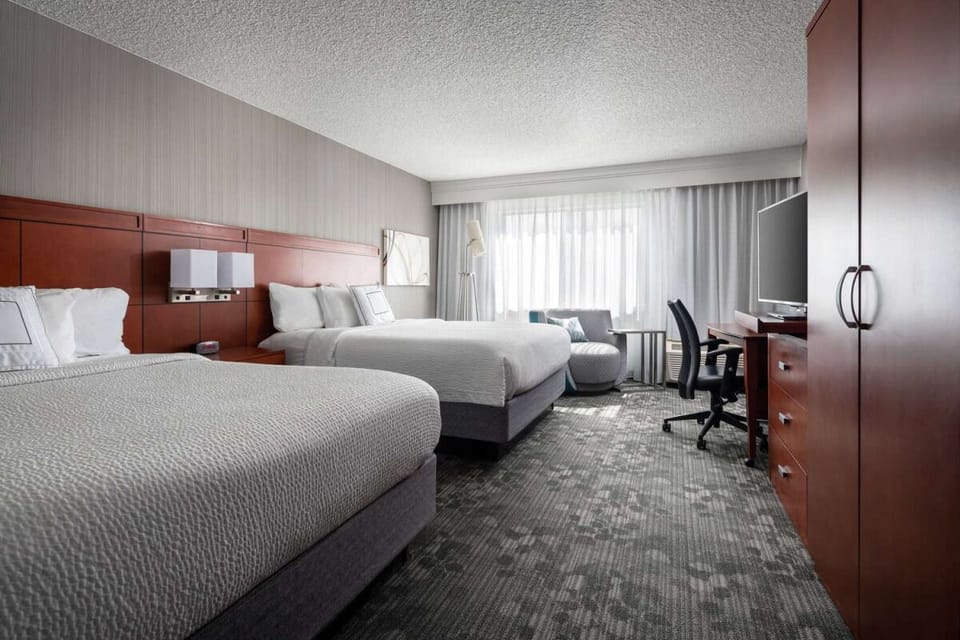 Unwind in a bright double room with plush bedding.