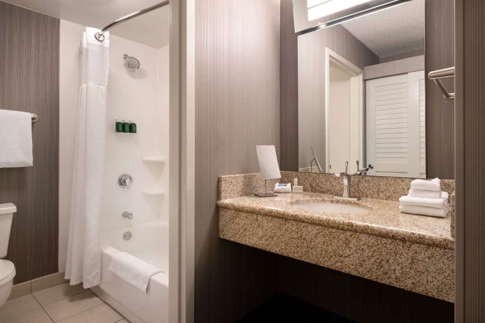 Soak and reset with a bright tub-and-shower combo.