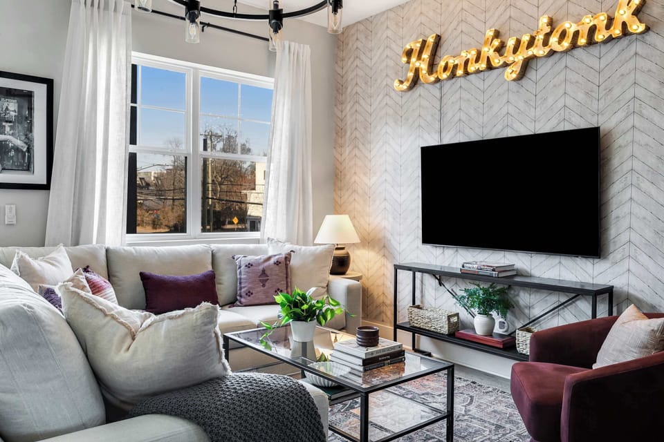 Comfortable seating, natural light, and a cozy setup perfect for relaxing or movie nights.