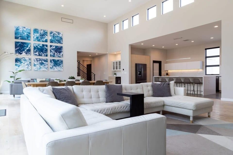 Beautiful white leather sectional with plenty of seating for everyone in the family