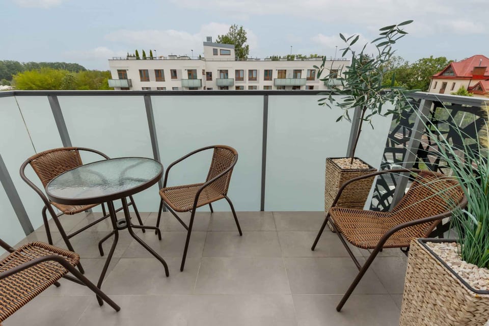 The balcony provides a tranquil spot for enjoying a book. 