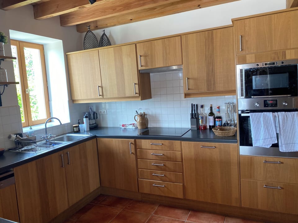 Modern, well equipped kitchen with crockery and glassware for 8 plus