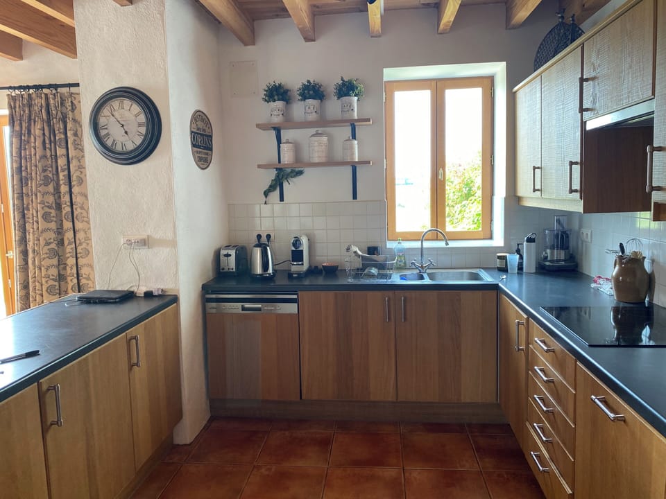 Fully equipped kitchen with a view of the fields