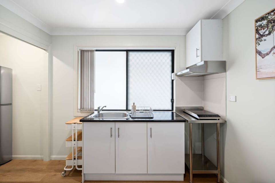 Kitchenette: Functional kitchenette for quick meal prep 