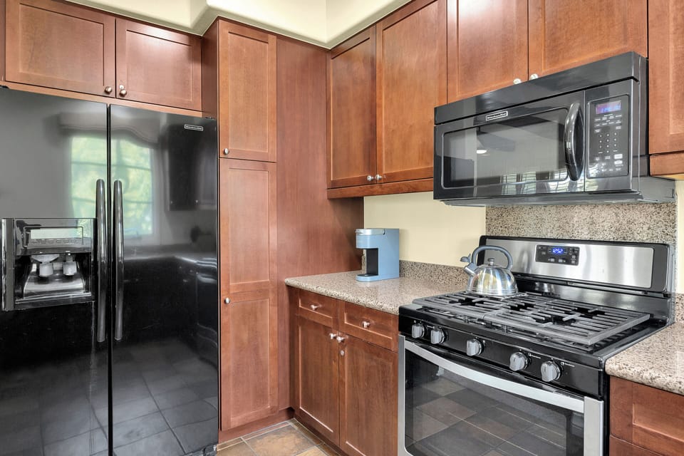 Plenty of cabinets in Kitchen for storage.