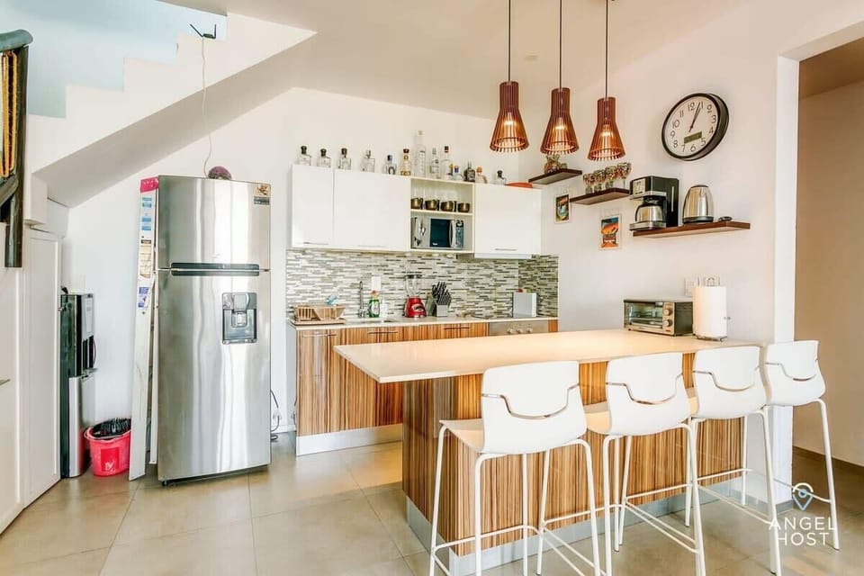 A fully-equipped kitchen to prepare meals at home & a great breakfast bar for 4!
